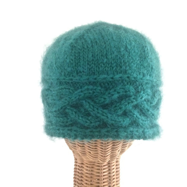 green cabled hand knit hat